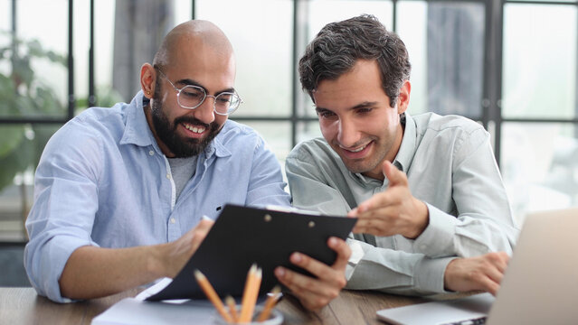 Businessman working on the table with laptop in a new office