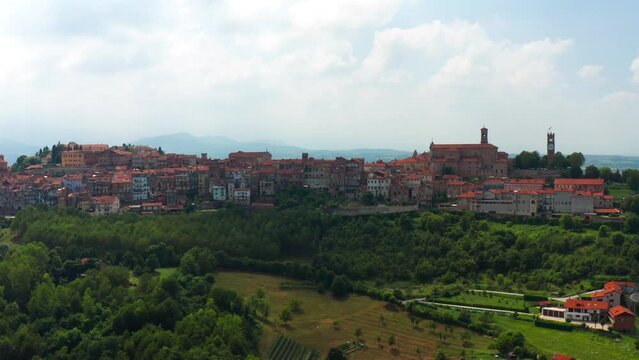 Aerial View Of Vicoforte Commune Buildings On Hilltop. Orbit Motion Shot