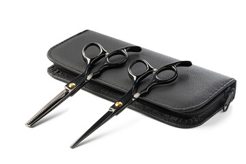 Hairdressing scissors with leather case on white background