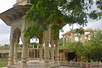 Majestic Royal Cenotaphs Amidst Verdant Greenery Under Cloudy Skies at Maharani Ki Chhatri ,Jaipur,...