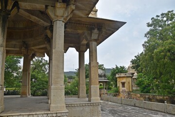 Majestic Royal Cenotaphs Amidst Verdant Greenery Under Cloudy Skies at Maharani Ki Chhatri ,Jaipur, Rajasthan, India