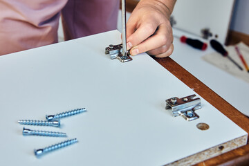 Flat pack furniture, assembling laminated particle board cabinet, installing adjustable invisible...