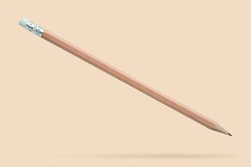 Brown pencil floated on brown background close up