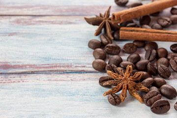 Obraz na płótnie Canvas coffee beans and spices on wooden table.