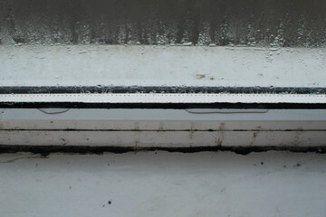 water on the glass of a plastic window