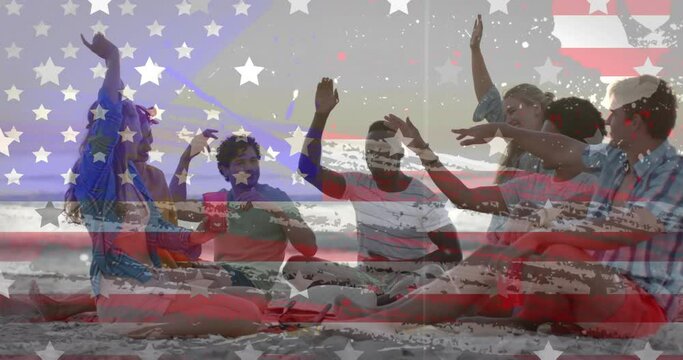 Animation of american flag and texture over happy diverse friends dancing, sitting on sunny beach
