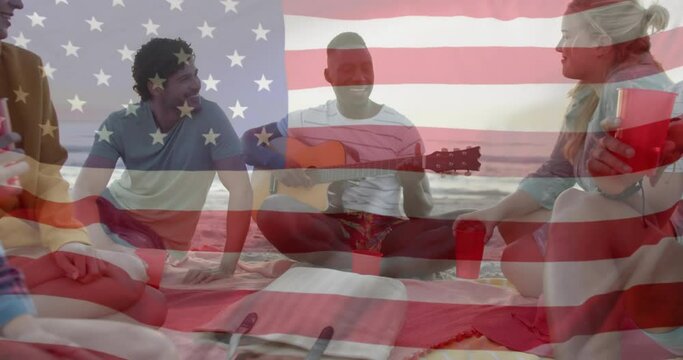 Animation of american flag over happy diverse friends playing guitar and singing on sunny beach