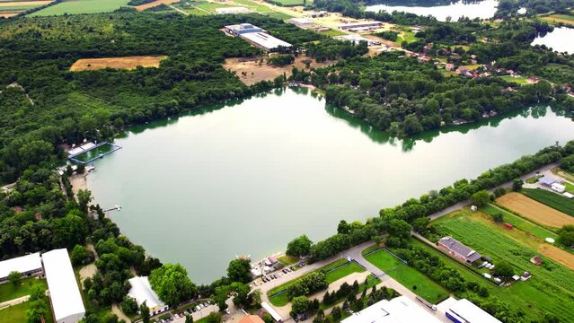 Aerial view of a lake in Bela Crkva surrounded with woods in summer day