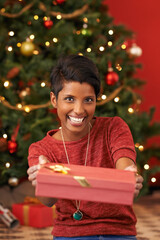 Christmas, portrait and woman with gift giving for celebration offer and kindness on festive...