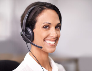 Happy woman, consultant and face with headphones at call center for customer service or support at office. Female person, agent or employee with smile for online advice or consulting at workplace