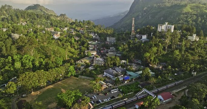 Ella Sri Lanka Aerial v6 cinematic birds eye view drone flyover railway station capturing charming mountain town, narrow streets and verdant valleys at sunset - Shot with Mavic 3 Cine - April 2023