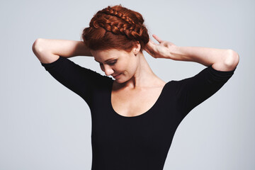 Woman, hair and braid crown for beauty in studio, elegant hairstyle for glamour and redhead on...