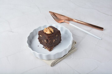premium freshly baked dark cocoa chocolate brownie square birthday cake with walnut peanut almond...
