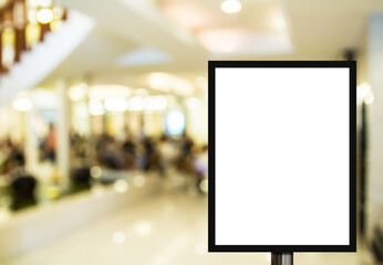 Blank advertising billboard or wide screen television with blurred shopping mall background