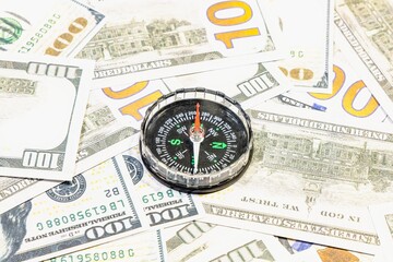 American currency banknote American dollars as a symbol of prosperity and success in business and affairs with a compass pointing west