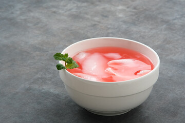 Es Kelapa Muda or young coconut ice with syrup
