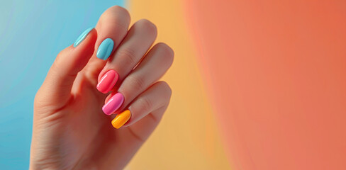 Bright multi-colored manicure on a woman's hand.