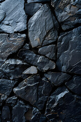 A detailed view of a bedrock wall constructed with grey rocks, creating a unique pattern. The outcrop contrasts with surrounding soil, wood, and metal elements
