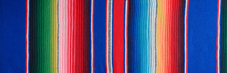 Cinco de Mayo background. Serape, colorful blanket with stripes. Banner.