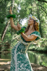 Elegant lady performing Hawaiian hula outside in the jungle environment. Concept of Polynesian artistic traditions. Sensation of joy and celebration.