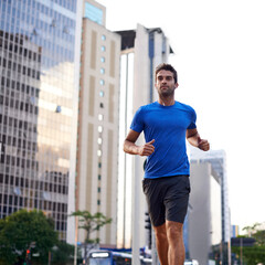 Fitness, health and man running in city training for marathon, competition or race. Exercise,...