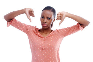 Black woman, portrait and thumbs down for disagreement or feedback, no and dislike emoji on white...