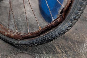 close up of broken and rusty bicycle wheel