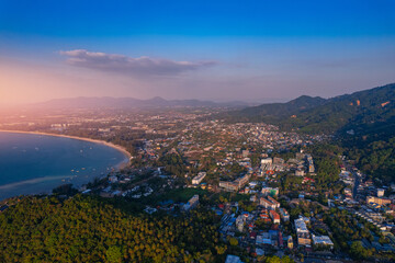 Aerial top view panorama sunset Surin beach with sea of Phuket paradise. Concept tropical travel photo Thailand