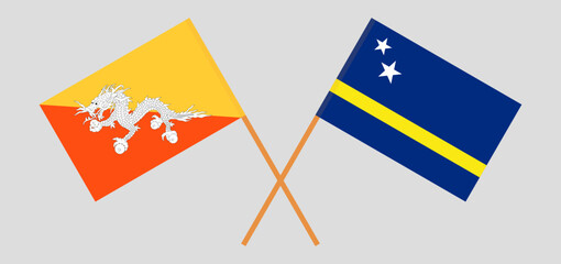 Crossed flags of Bhutan and Country of Curacao. Official colors. Correct proportion