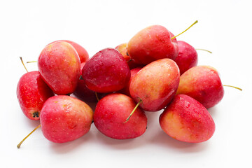 Fresh small red apples on white background