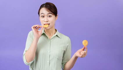 Photo of young Asian woman on purple background