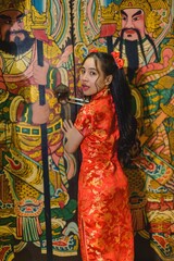 Asian beautiful woman Dress in Chinese style, Chinese New Year festival at night