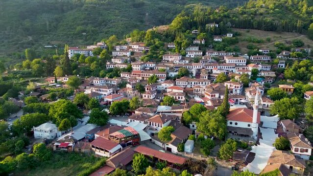 Traditional houses in Sirince village, Izmir Province, Turkiye. 
full of green trees in Heritage Site. Drone view