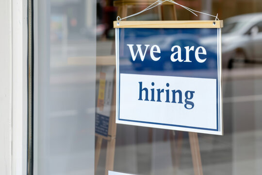 We are hiring sign in a shop or office window