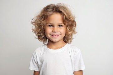 Portrait of a smiling little girl in a white t-shirt