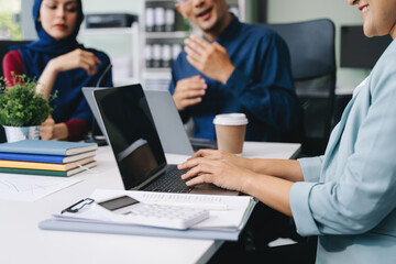 Business partners discussing documents and ideas with smart phone and digital tablet and graph business at meeting working new start up project. .