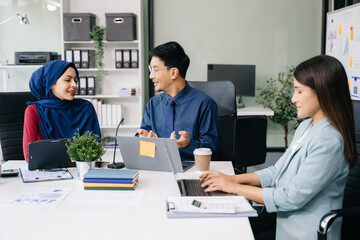 Obraz premium Business team discuss at meeting room. working together with laptop ,tablet and smart phone on desk Financial accountant , planner , meeting , introduction concept. .