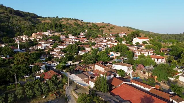 Traditional houses in Sirince village, Izmir Province, Turkiye. 
full of green trees in Heritage Site. Drone view