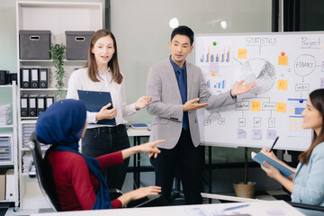 Multiracial group of young creative people in smart casual wear discussing business brainstorming meeting ideas design project.