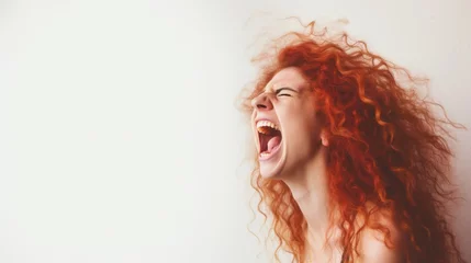 Fotobehang A screaming woman on a white background and a copyspace © Katya