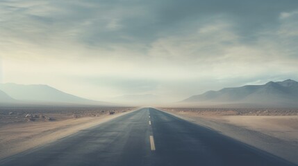 Fototapeta na wymiar An empty highway in a mountain valley