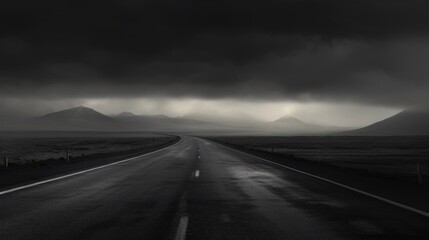 An empty highway in a mountain valley
