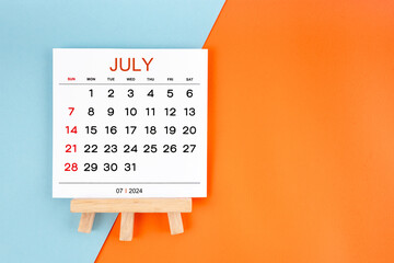 2024 July calendar page on blue and orange background.
