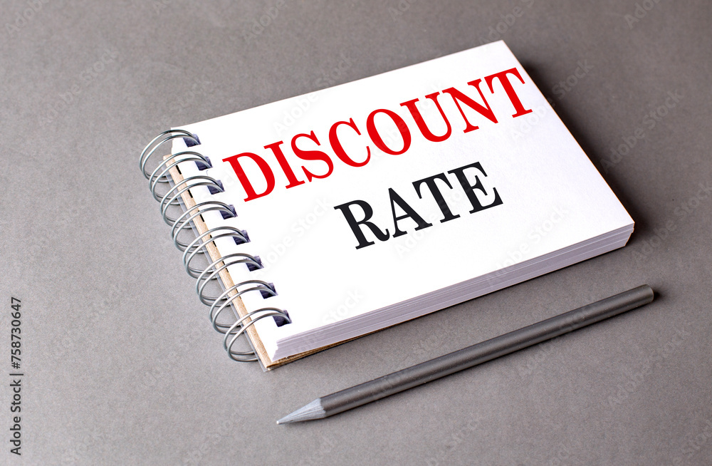 Poster discount rate text on notebook on grey background