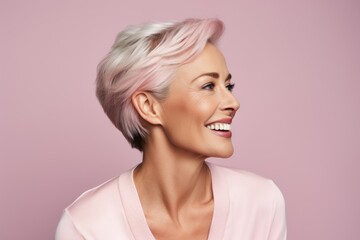 beauty, people and hairstyle concept - smiling woman with pink hair over pink background