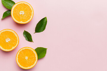 fresh Fruit orange slices on colored background. Top view. Copy Space. creative summer concept. Half of citrus in minimal flat lay with copy space