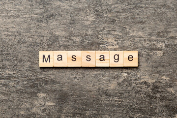 massage word written on wood block. massage text on cement table for your desing, concept