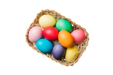 Basket of colorful Easter eggs isolated on white background. Easter basket filled with colored eggs top view holiday concept