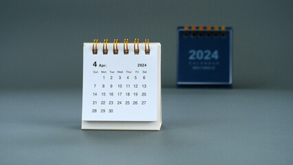 Desk calendar for April 2024 on a gray background