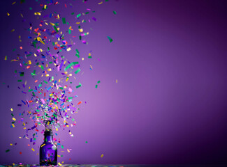 beautiful bottle with confetti popping out in purple, green, pink, blue and yellow, background is...